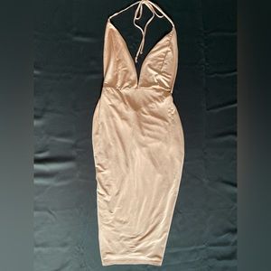 Pink silk dress with open back.